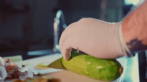 Kitchen chef cutting zucchini on the cutting board Stock-Footage 104195856