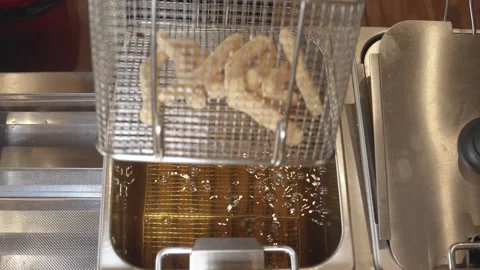 Kitchen chef preparing a dish of fried breaded cuttlefish. (A) Stock Footage 165464367