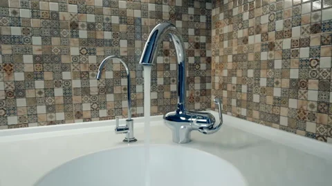 In the kitchen, clean tap water flows into a white washbasin Stock Footage 99925831