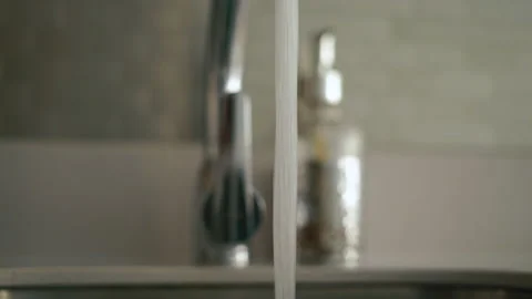 Kitchen concept. Water flows into the sink close up shot Stock Footage 169183170