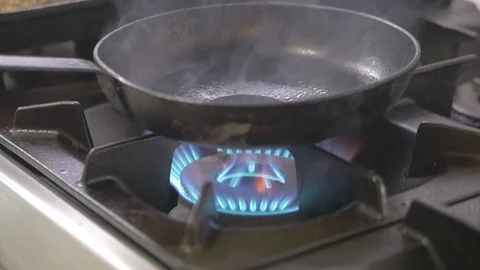 Kitchen Cooker gas blue meat on flames flambing Stock Footage 115069342