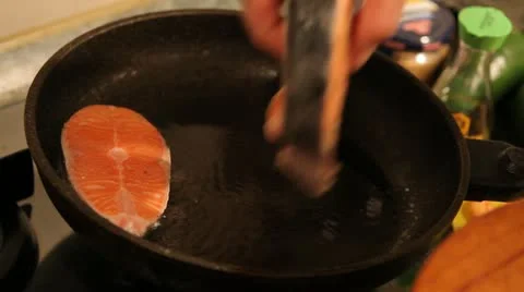 Kitchen. Cooking a fish. Stock Footage 22241374