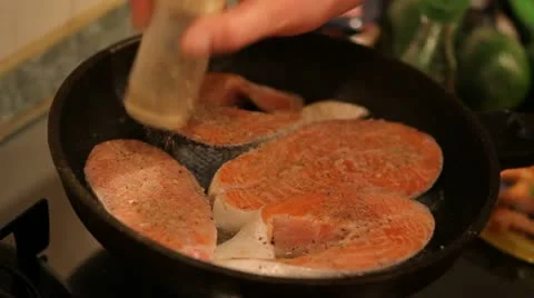 Kitchen. Cooking a fish. Stock Footage 22241451