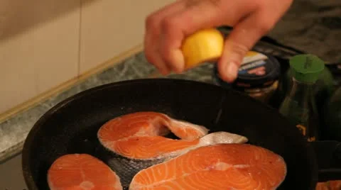 Kitchen. Cooking a fish. Stock Footage 22241461
