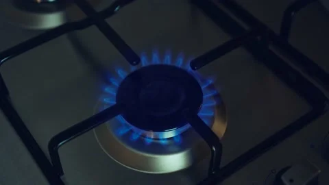 Kitchen cooktop gas burner with blue fire goes out due to termination supplies Stock Footage 204854768