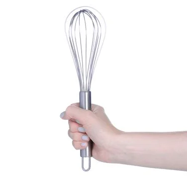 Kitchen corolla whisk in hand Stock Photos