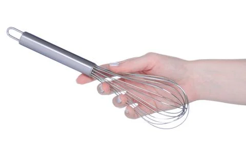 Kitchen corolla whisk in hand Stock Photos