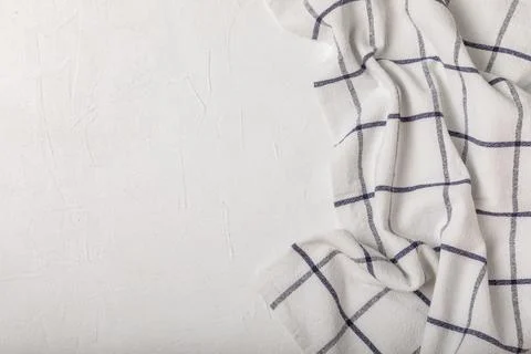 Kitchen cotton towels with a simple pattern folded on table Stock Photos