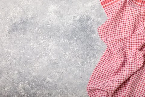 Kitchen cotton towels with a simple pattern folded on table Stock Photos