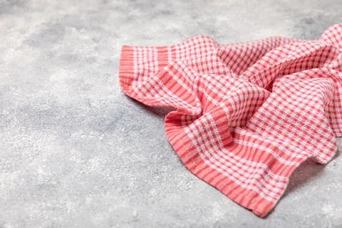 Kitchen cotton towels with a simple pattern folded on table Stock Photos