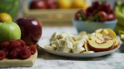 Kitchen counter filled with fruit platters - closeup, tracking shot Stock Footage 341205287