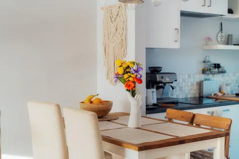 Kitchen counter table with focus on vase made in shape of human hand with Stock Photos