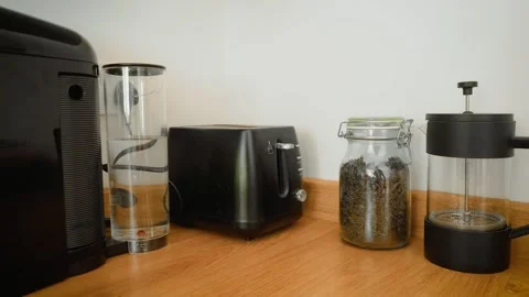 Kitchen countertop with coffee machine, toaster and French press coffee maker Stock Footage 336718030