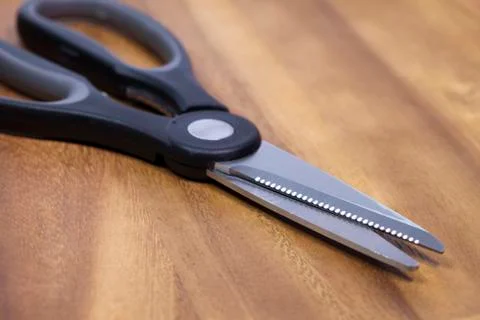 Kitchen, culinary scissors on a wooden table Foto stock