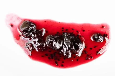 Kitchen currant jam smear with chunks. Experimental smear of currant jam show Foto stock