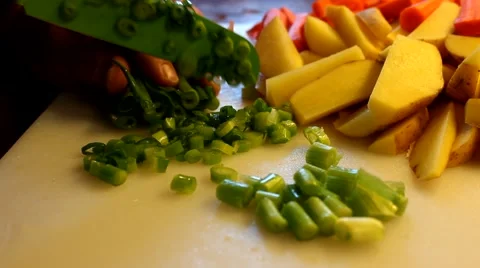 Kitchen cutting vegetables on cutting board Video stock 48384907