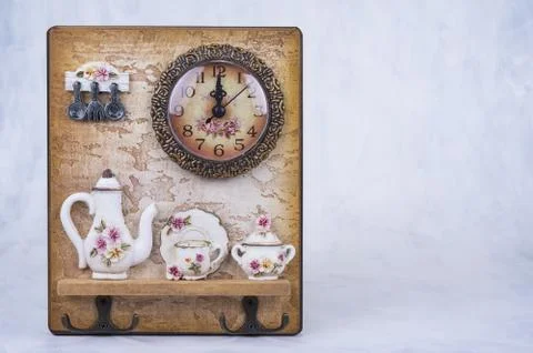 Kitchen decoration with clock and hanger for towels Stock Photos
