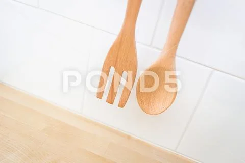Kitchen decoration Wood spoon and folk in clean new home cuisine. Stock-Fotos