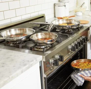 Kitchen with different dishes barnar Stock Photos
