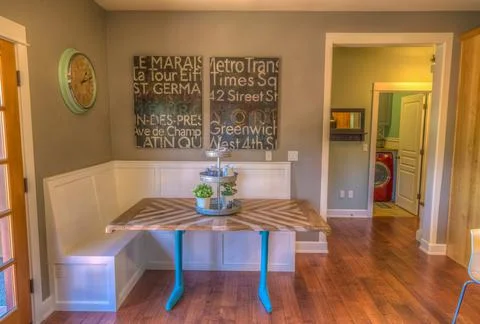 Kitchen dining nook with bench, large clock Stock Photos