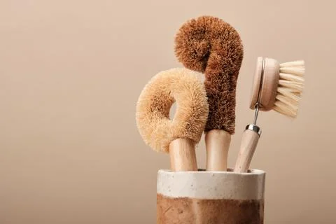 Kitchen Dish Brushes in Brown Ceramic Cup Stock Photos