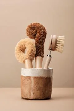 Kitchen Dish Brushes in Brown Ceramic Cup Stock Photos