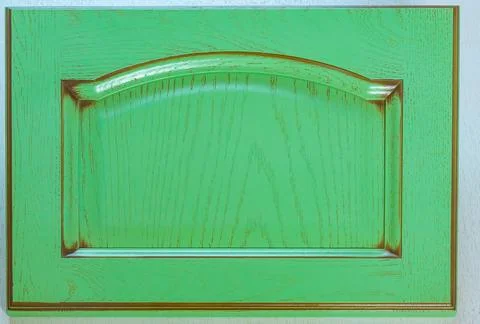 Kitchen door facade made of solid oak wood covered with green paint in shabby Stock Photos