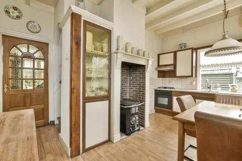 A kitchen with a door to a pantry Stock Photos