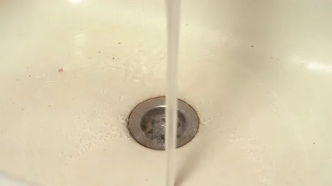 Kitchen drain clogging up with food particles Stock Footage 147126330