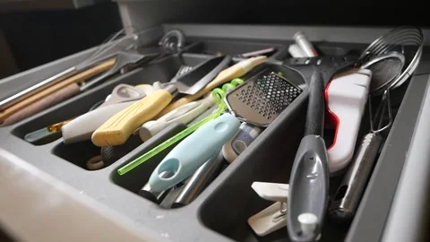 Kitchen drawer filled with utensils and tools for cooking Stock Footage 333358694