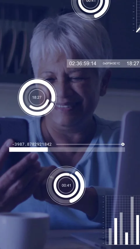 In kitchen, elderly woman using smartphone with animation of data analytics 動画素材 319811576