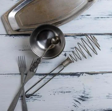 Kitchen empty metal objects on a white wooden background Stock Photos