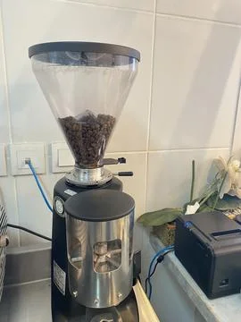 Kitchen with espresso machine and coffee bean grinder Stock Photos