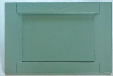 The kitchen facade is made of solid oak, covered with gray paint in the Scand Stock Photos