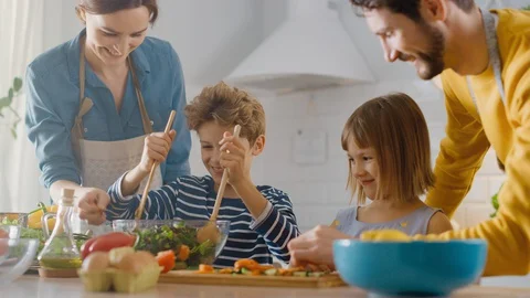 In Kitchen: Family of Four with Little Children Cooking Together Healthy Dinner. Stock Footage