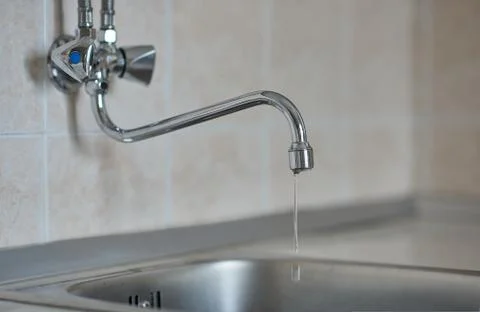 Kitchen faucet is broken, horizontal view Stock Photos