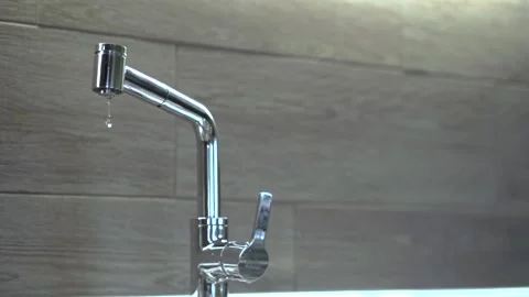 Kitchen faucet leaking, copy space on the right, Stock Footage 219399681