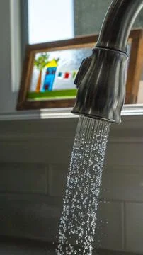 Kitchen Faucet Running Stock Photos