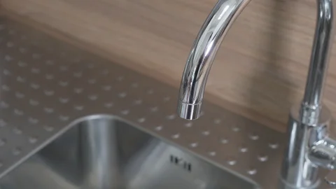 Kitchen faucet tracking shot Stock Footage 128977601