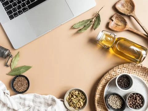 Kitchen flat lay with copy space for culinary text, laptop, oil in bottle and Stock Photos