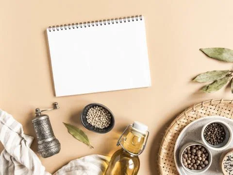 Kitchen flat lay with open notebook for culinary text and small bowls various Stock Photos