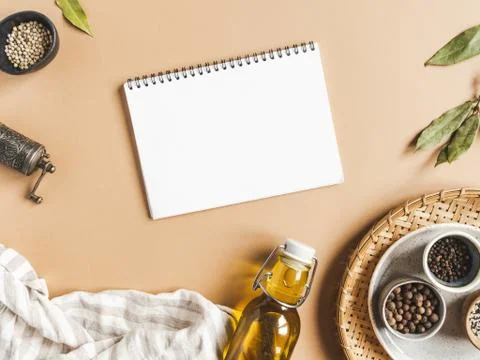 Kitchen flat lay with open notebook for culinary text and small bowls various Stock Photos