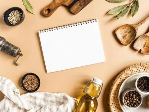Kitchen flat lay with open notebook for culinary text and small bowls various Stock Photos