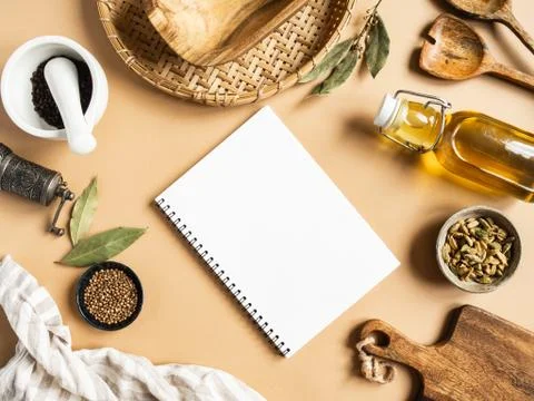Kitchen flat lay with open notebook for culinary text and small bowls various Stock Photos