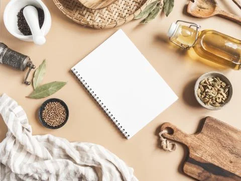 Kitchen flat lay with open notebook for culinary text and small bowls various Stock Photos