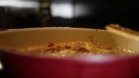 In the kitchen in a frying pan preparing food Stock Footage 86156341