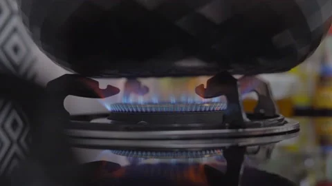 Kitchen gas stove burnner with flames burning Stock Footage 132978808