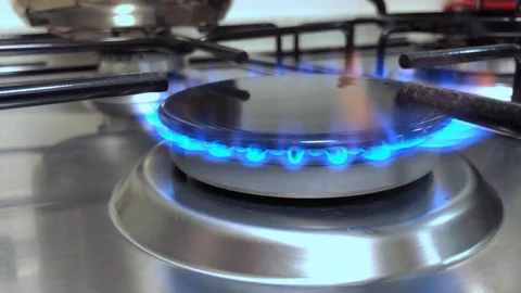 Kitchen gas stove. Close up burning flame Stock Footage 93554166