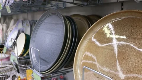 Kitchen goods store, new plates on the shelf Video stock 240033158