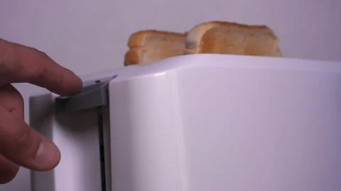 In the kitchen, a guy (girl) pulls out food from the refrigerator. Stock-Fotos